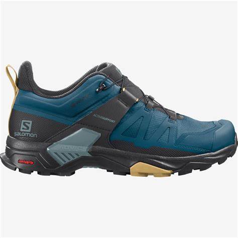 Salomon X Ultra 4 GTX hiking shoe in blue and grey, featuring a low-cut design, quick-lace system, and rugged outsole for excellent traction.