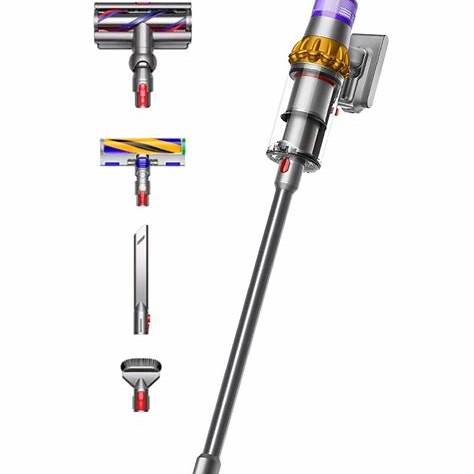 Top 2025 Stick and Upright Vacuums: Expert Picks 2 Dyson cordless stick vacuum with multiple interchangeable heads including a motorized brush, crevice tool, and dusting brush.